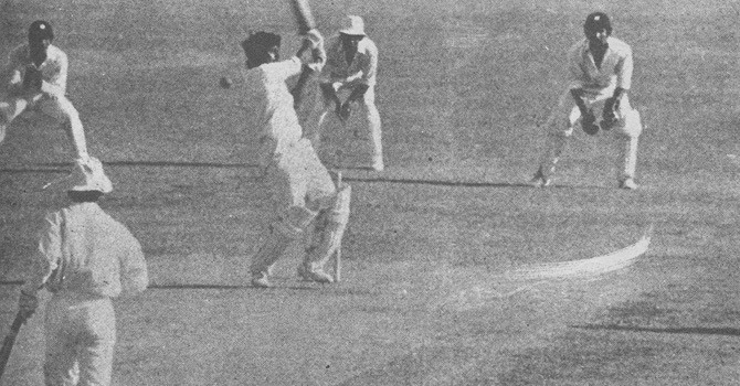 Javed+Miandad+swings+but+misses+a+delivery+from+Joel+Garner,+is+hit+on+the+pads+and+given+out+LBW.+Asif+Iqbal+watches+from+the+non-strikers+end.1976-77.bmp